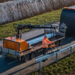 Rail Raise 100 on a flatbed trailer